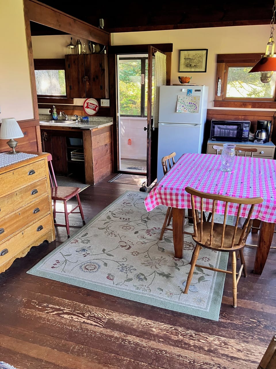 View of dining table, entry porch and kitchen.  
