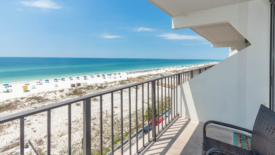 Enjoy stunning beachfront views from this inviting balcony, perfect for relaxing and soaking in the coastal atmosphere