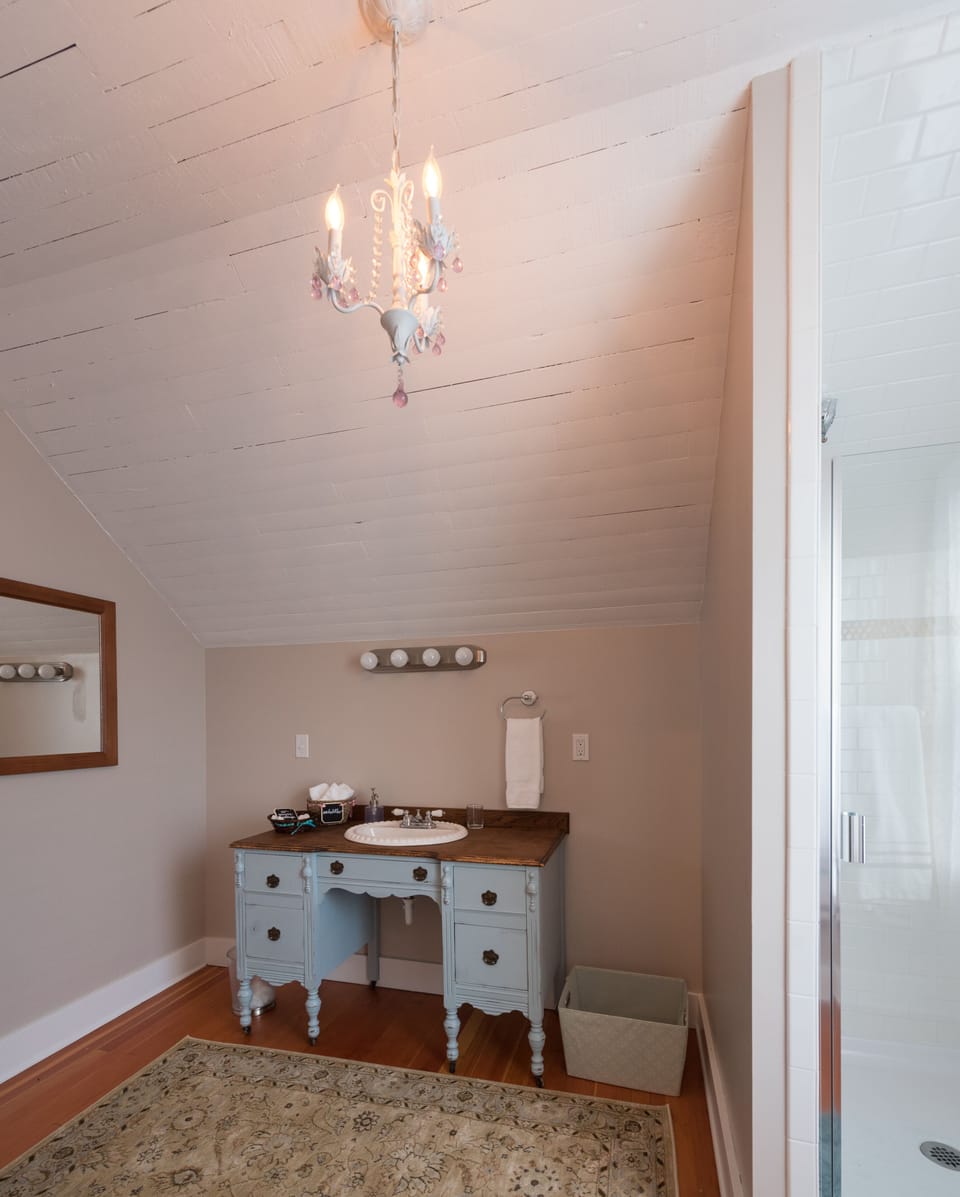 Guest bathroom is roomy with shower and vanity.