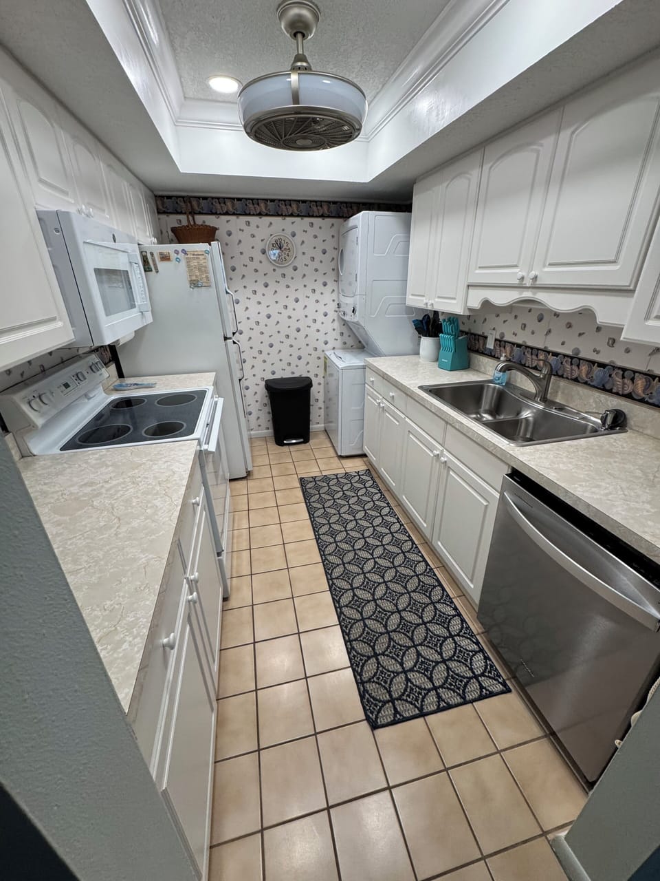 Well supplied kitchen with all you need to make at home meals & washer /dryer