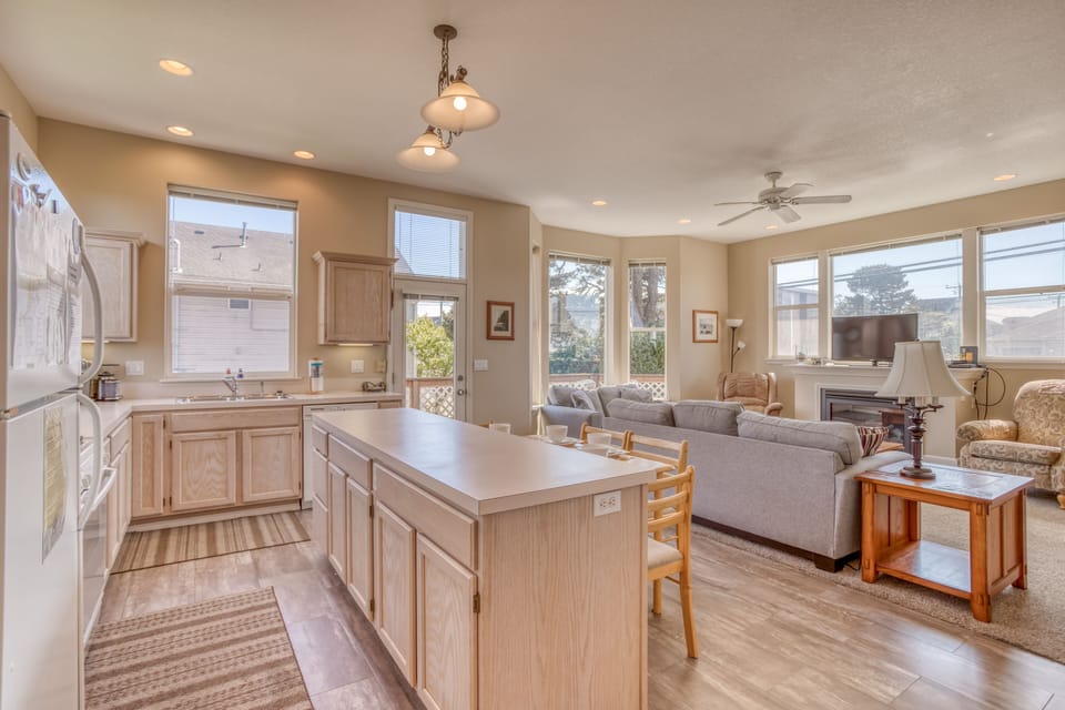 Kitchen with island and view of the Living Room