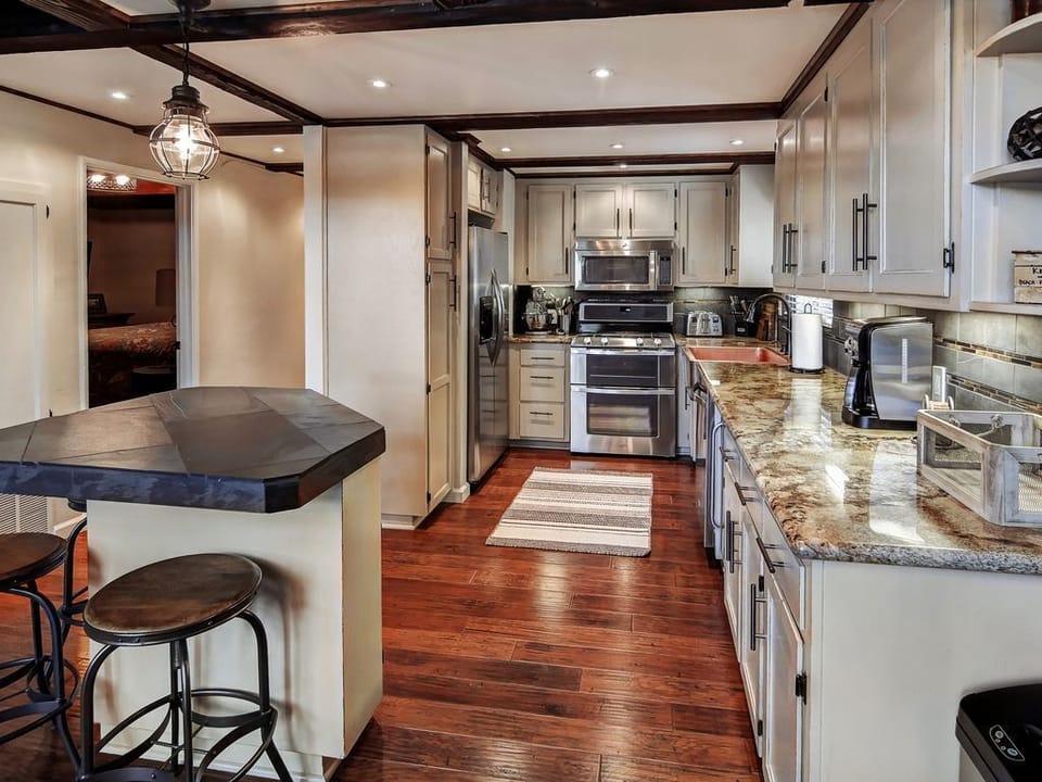 Fully equipped  kitchen with granite countertops and stainless steel appliances