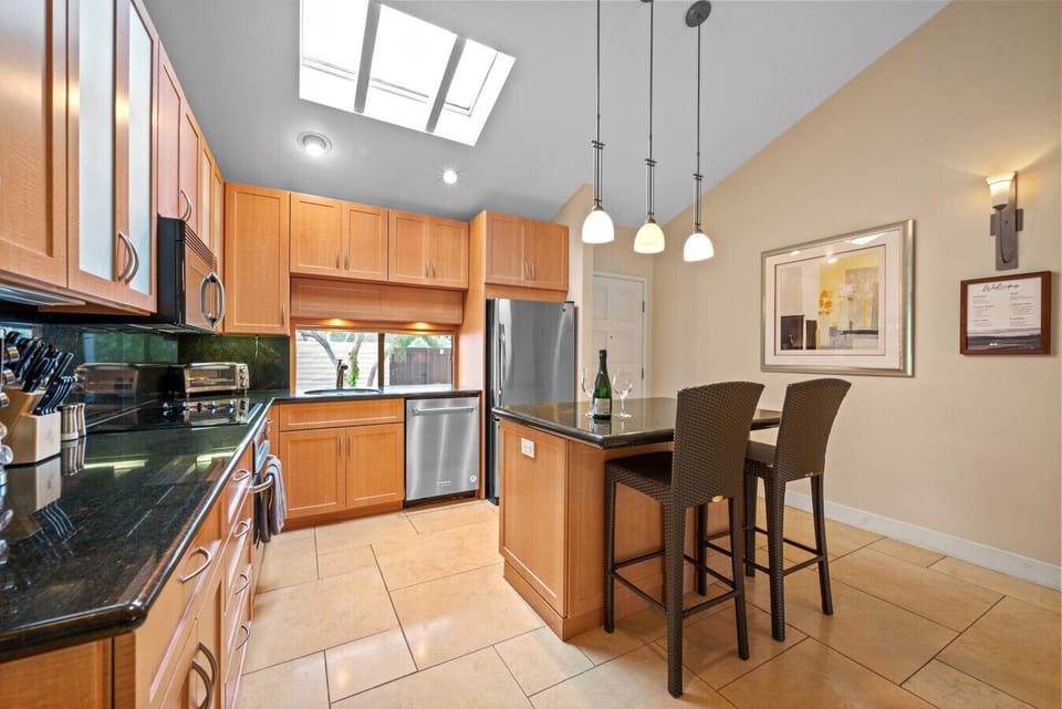 Open floor plan for kitchen and living room. New kitchen supplies, fully stocked! New 75 inch smart TV.  Golf views out rear patio