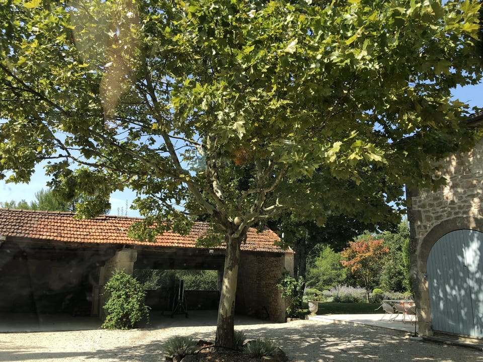 The open garage area next to the house.