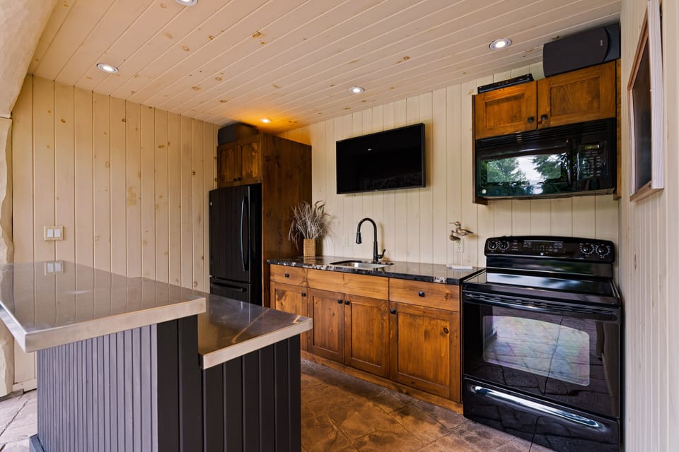Outdoor cabana fully equipped with fridge, stove, microwave