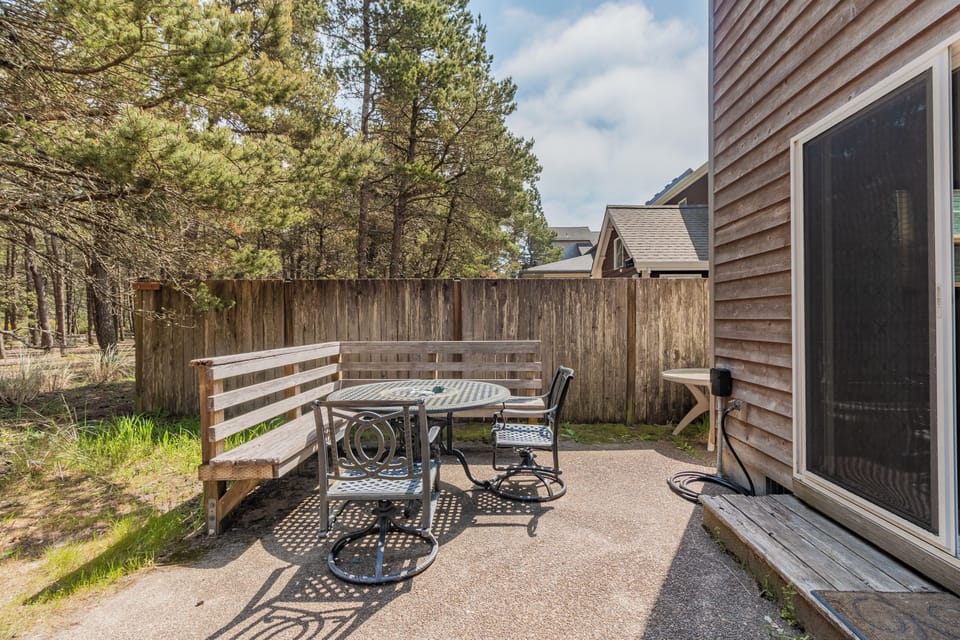 Relax at your private patio with comfortable seating, surrounded by towering pines and peaceful mountain air—perfect for morning coffee or evening gatherings under the open sky.
