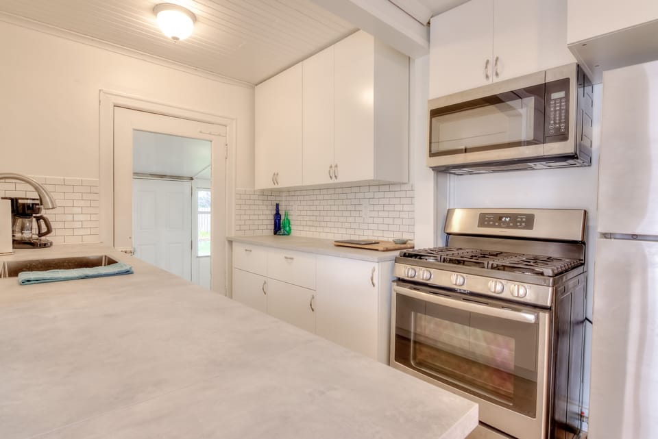 Kitchen with stove and microwave