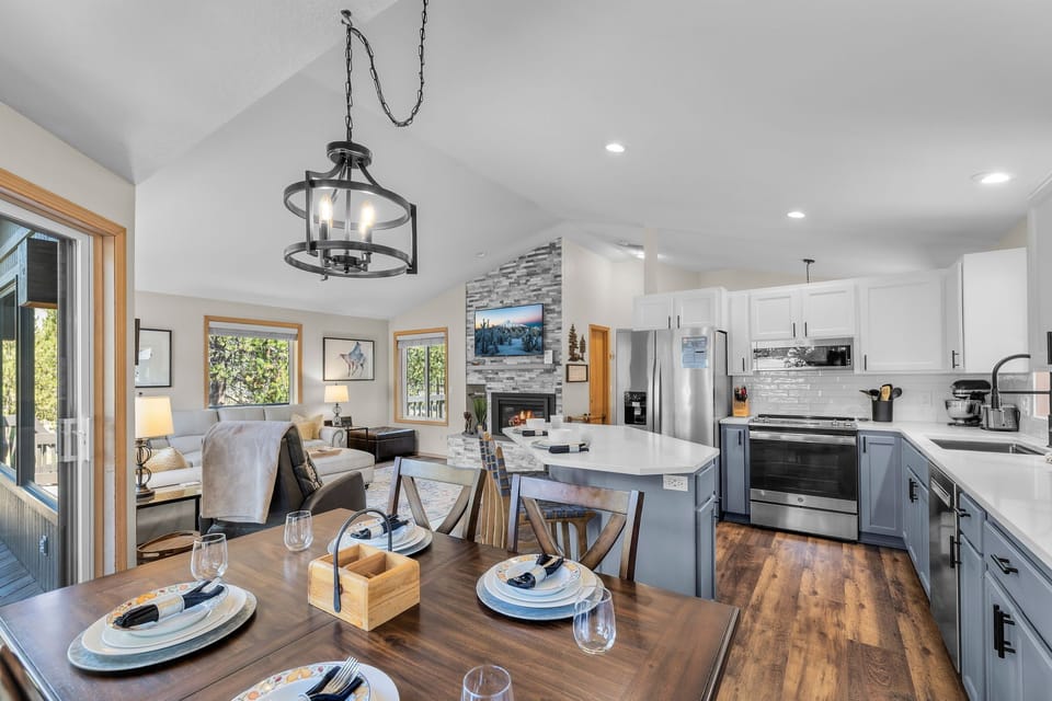 Settle into your open-concept living space where natural light floods the kitchen, dining, and lounge areas—perfect for gathering with loved ones after a day of adventure.