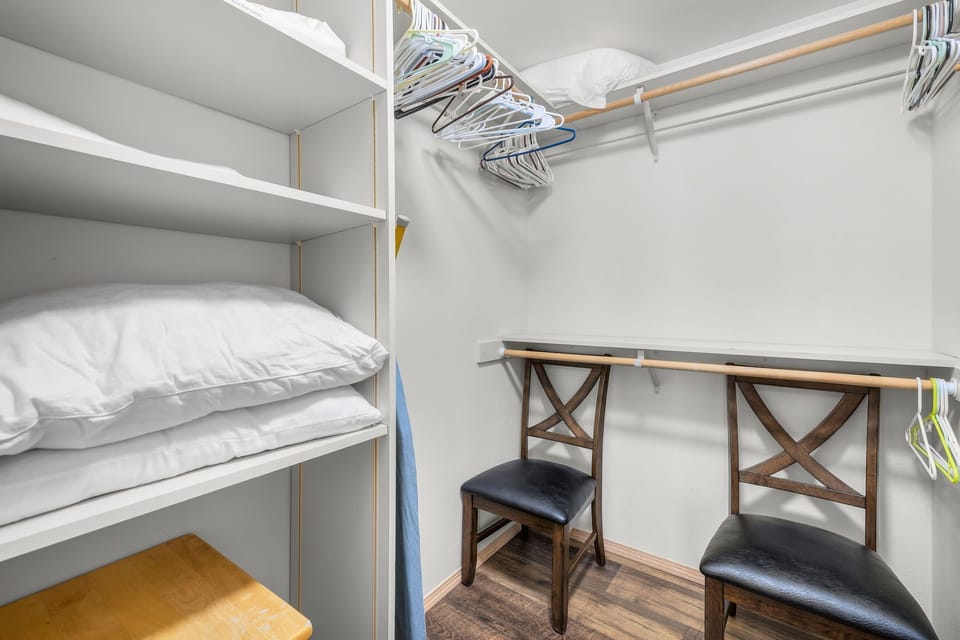 Your wardrobe comes with built-in shelving for linens, plenty of hanging space for your clothes, and a convenient fold-down desk for working or planning your day.