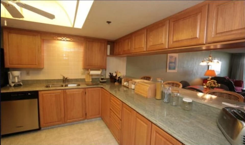 Kitchen with full fridge, ice maker, dishwasher, full stove/oven, OTR.