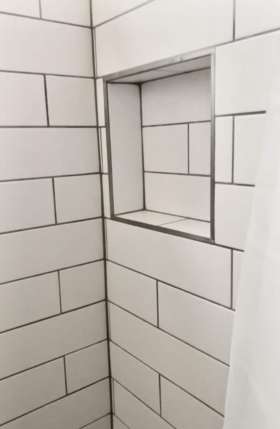 Modern upgraded subway tile shower.