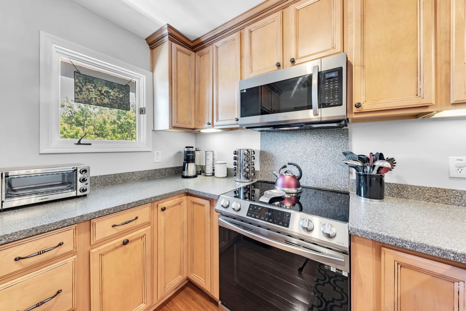 Little kitchen, big charm.  Soft textures, warm light, and cozy corners make it feel like home.