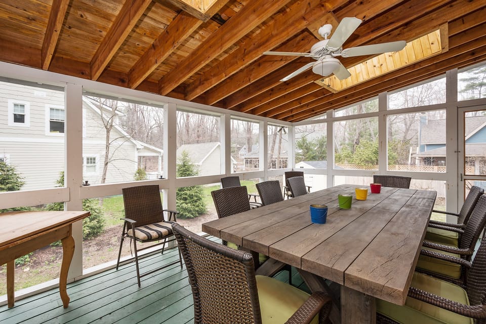 Spacious screened in porch overlooking the yard, hot tub off of the porch