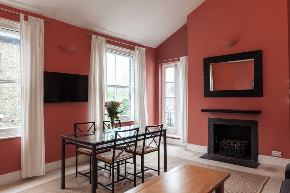 Sitting Room with Dining Table and doors out to the balcony