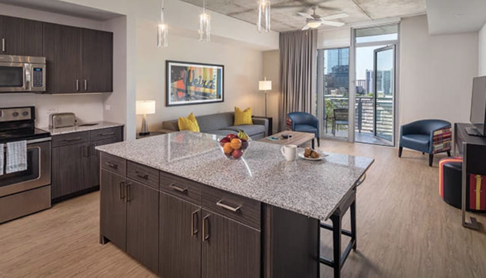 Comfortable Living Room and Kitchen **Note, not all 1B units have balconies