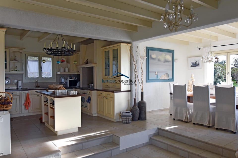 The fully equipped open-plan kitchen near the dining and living area