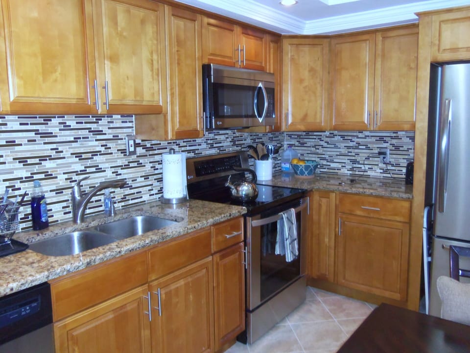 Newly renovated kitchen with granite counter top.
