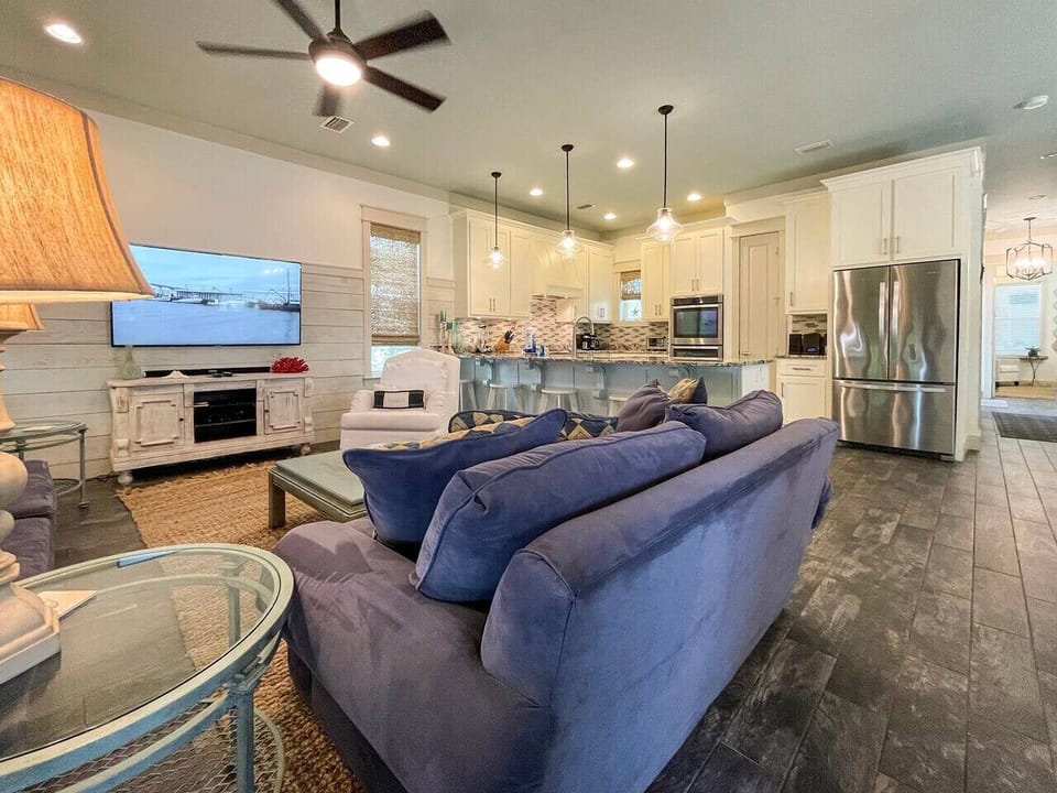 Living area features a large flat screen Smart TV and sound bar
