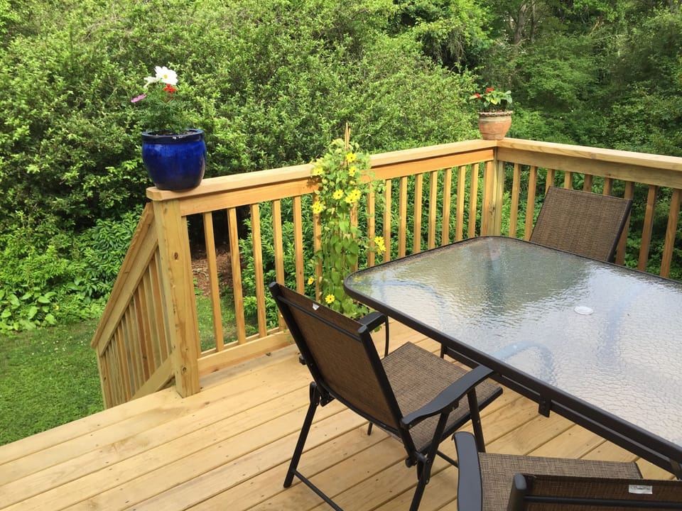 Sunny private deck with steps to back yard