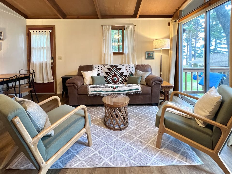 Living room area with dining table that seats 4