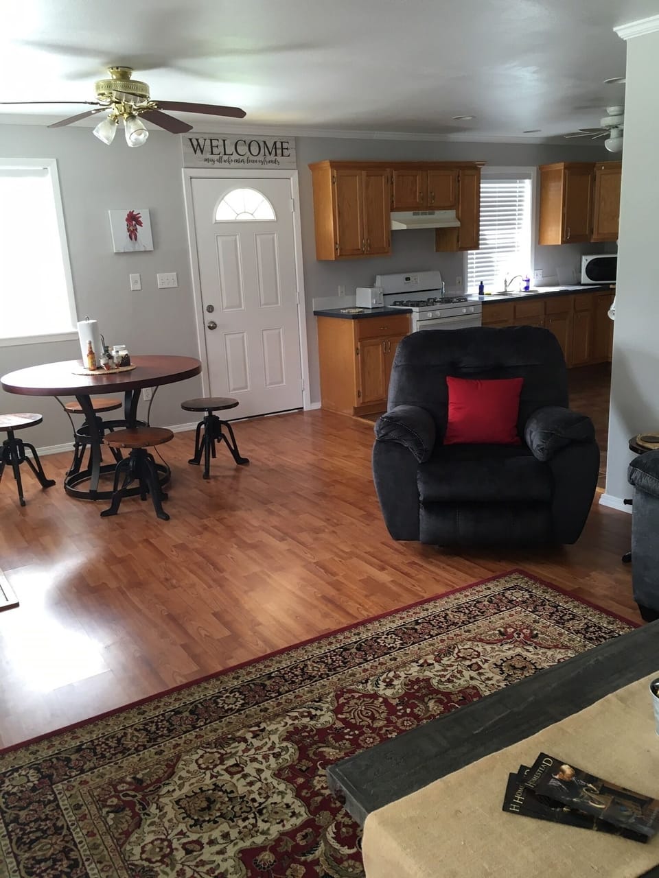Dining area with seating for five. The side door leads to porch and fenced yard.