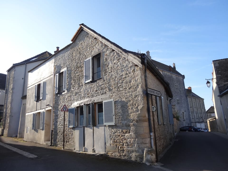 Le Coin exterior, on the left is lane way to village square.