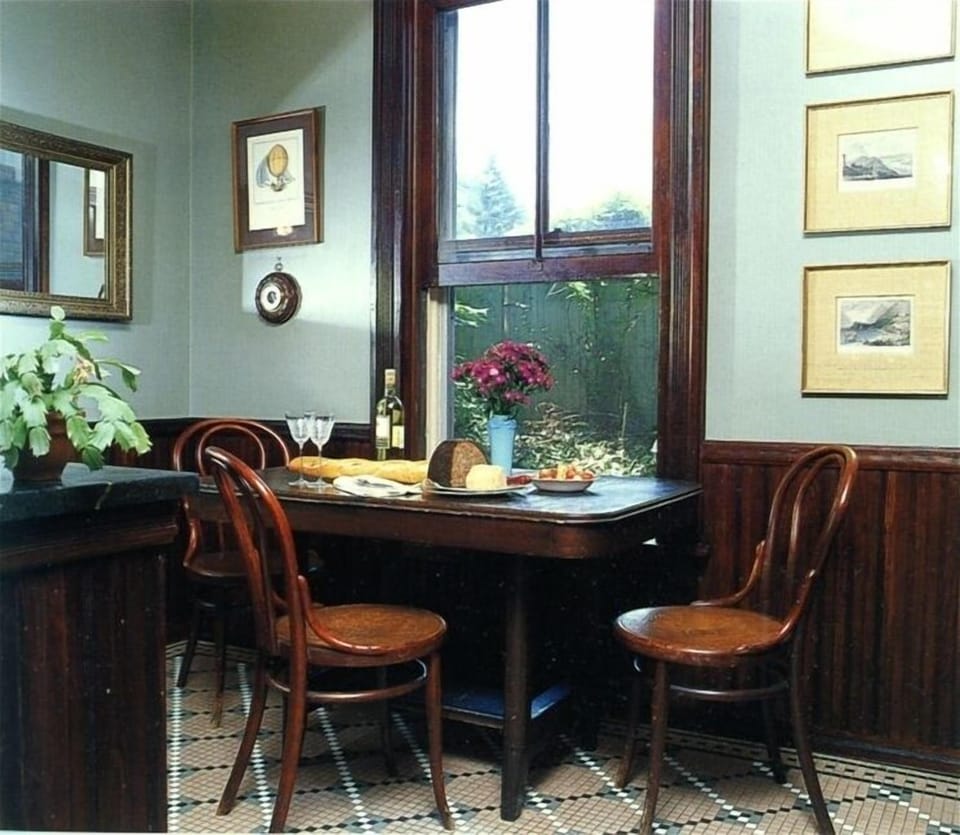 The kitchen's table & chairs create an informal spot for eating--or chatting.