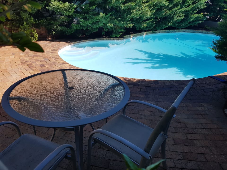 Outside table & chairs for breakfasts etc
View from the pool-facing bedsitter