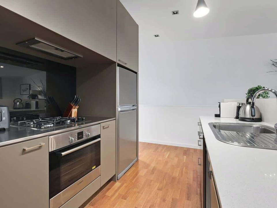 Fully equipped kitchen with fridge freezer, oven, cook top, microwave and Nespresso coffee pod machine