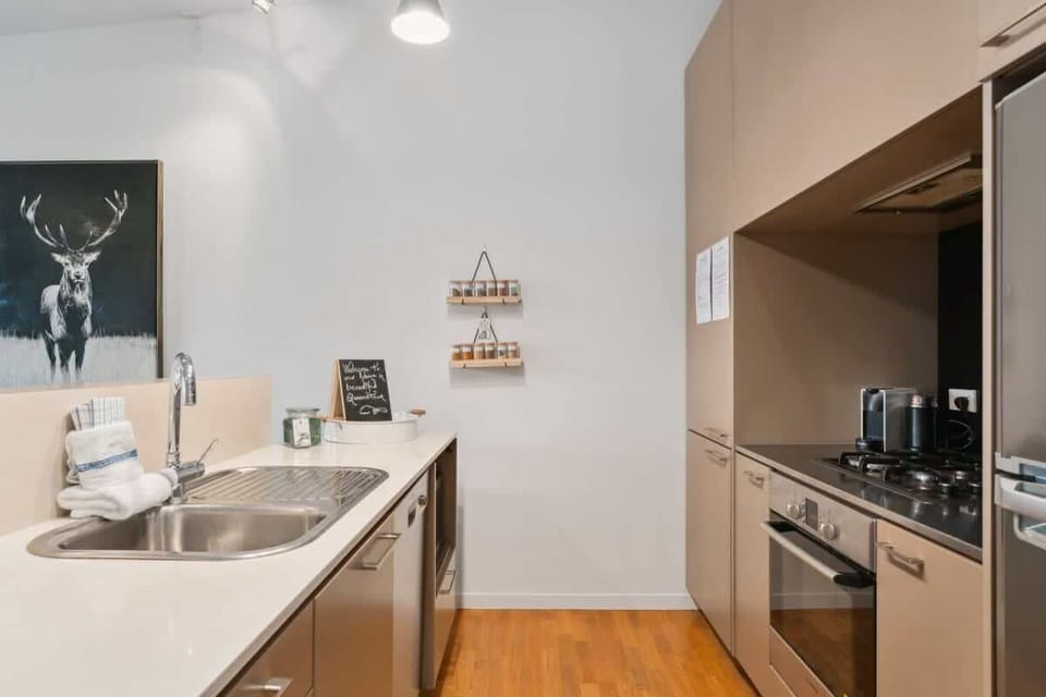 Fully equipped kitchen with fridge freezer, oven, cook top, microwave and Nespresso coffee pod machine