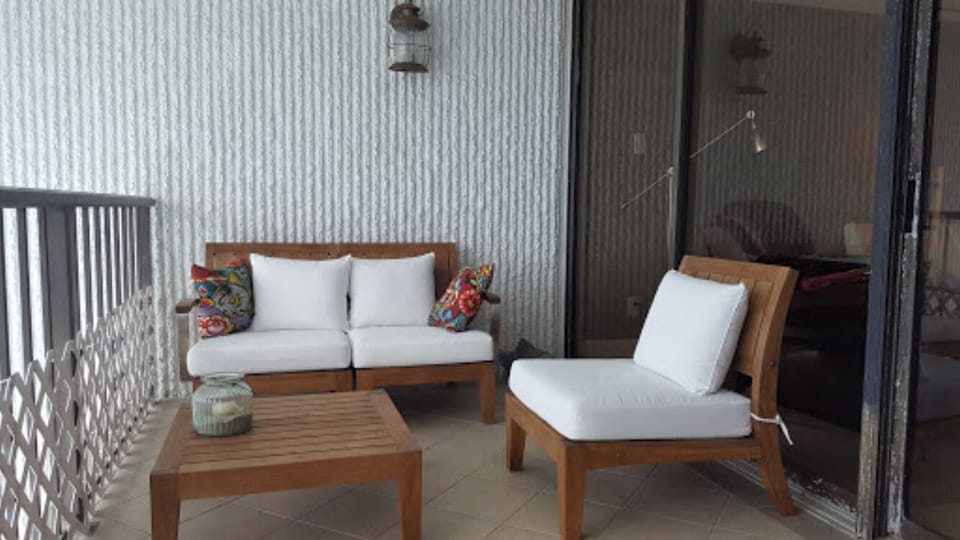 Enjoy your morning coffee on the balcony with teak furniture w/ deep cushions.