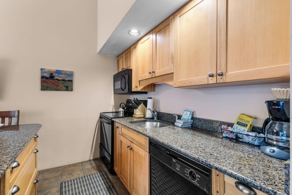 Your fully equipped kitchenette awaits with granite countertops, modern appliances, and everything you need to prepare meals on your own schedule.