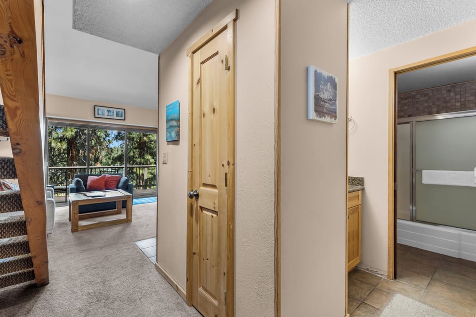 Step inside to find open, airy spaces connecting seamlessly to your private balcony, where natural light and forest views create a perfect retreat.