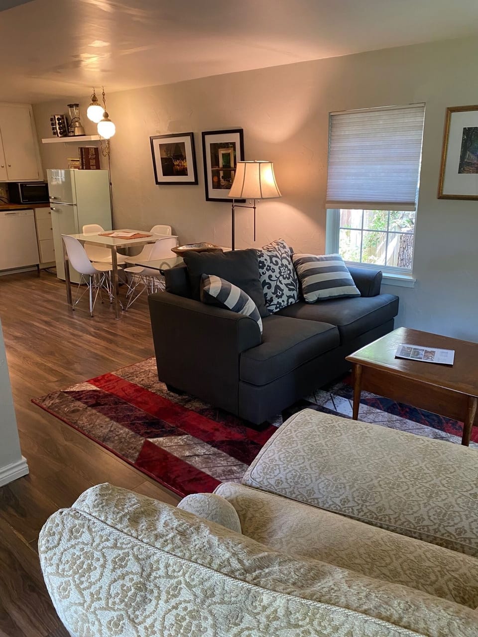 View of living space and kitchen from front door.