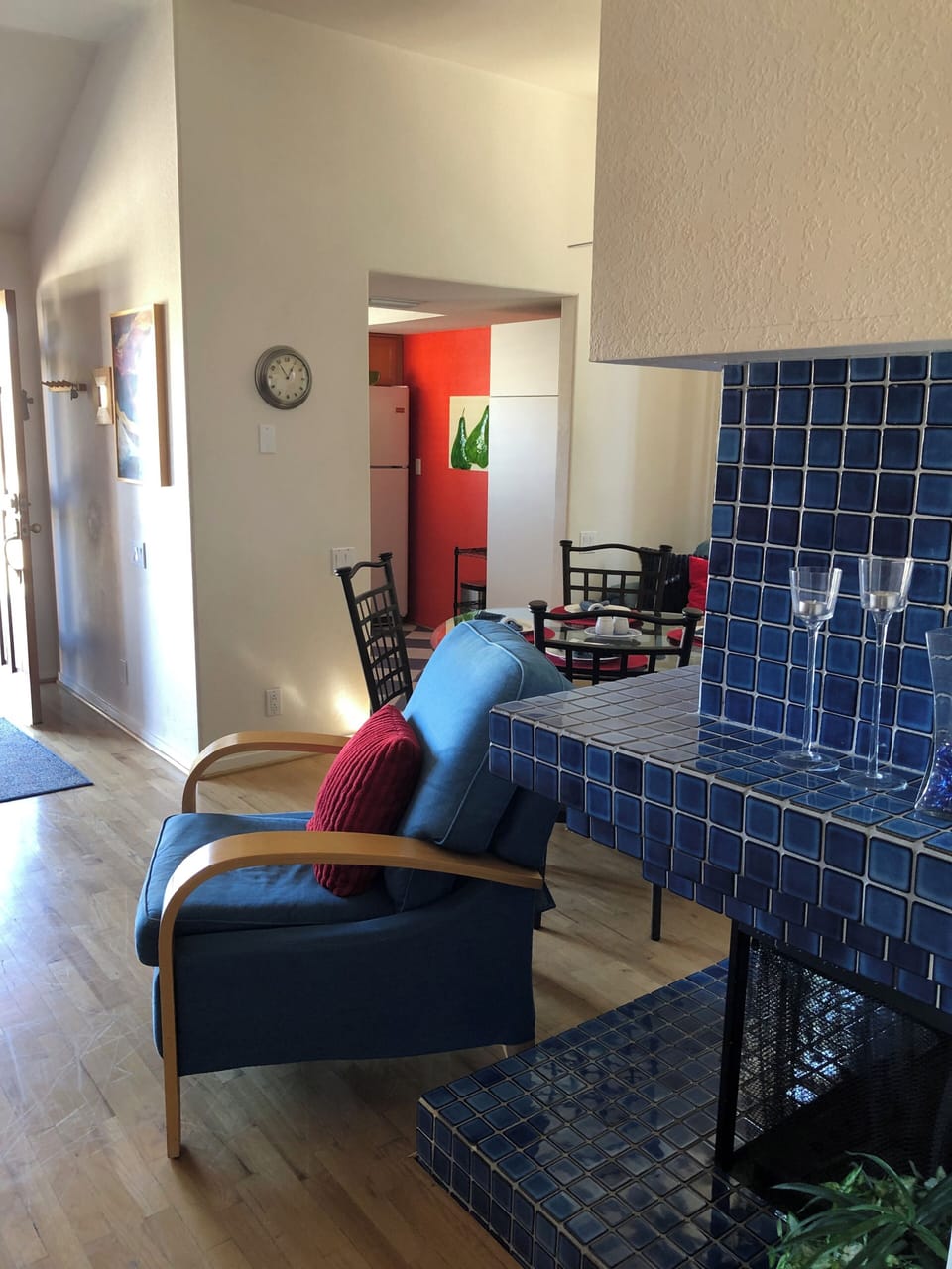 Cobalt blue stone fireplace, and one of two recliners. 