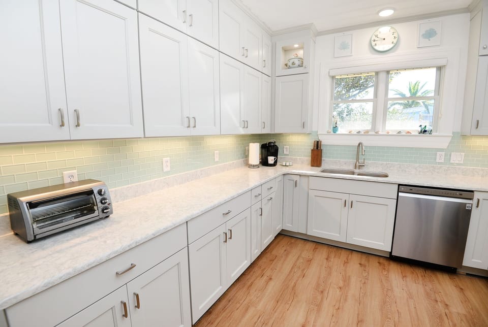 Cabinets have all you need for a large group cooking and eating.