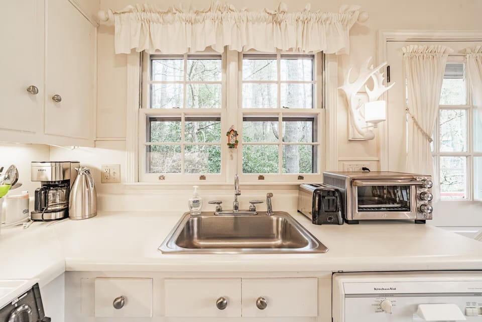 Kitchen sink window overlooks side yard.
