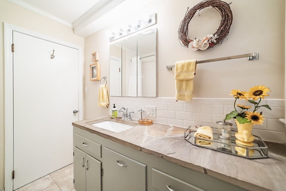 Full bathroom on main level. Artist's seashells from SC beaches featured. 
