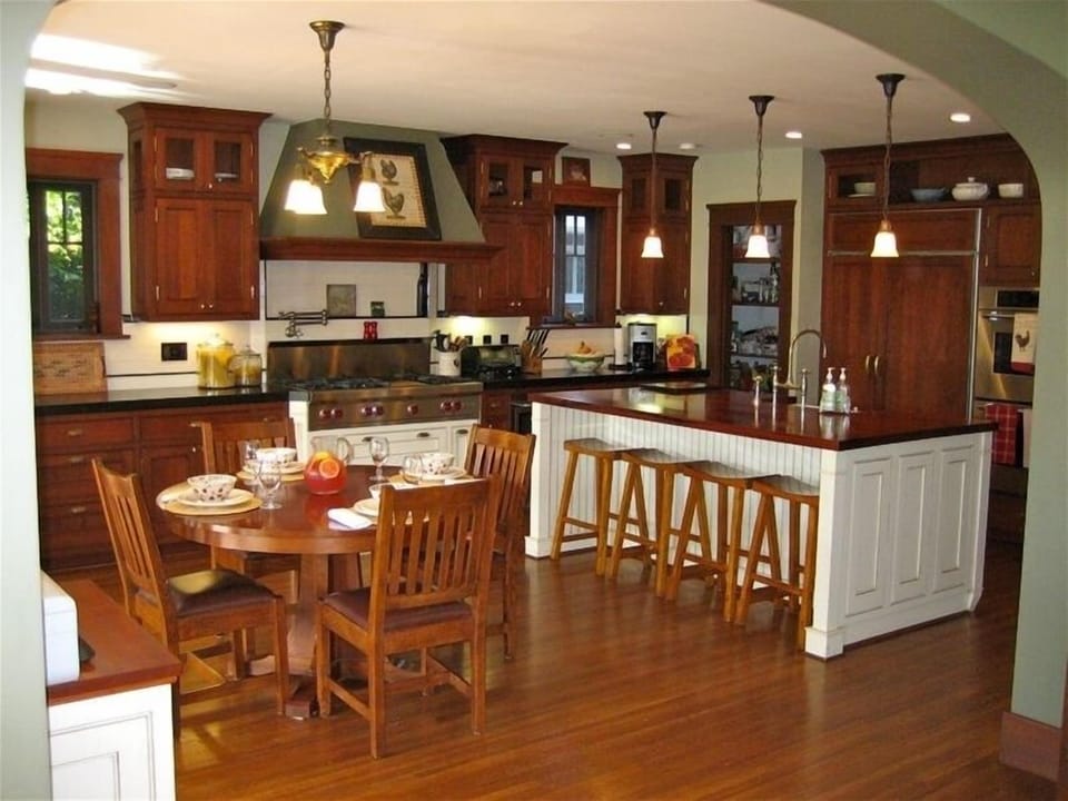 Spacious eat-in gourmet kitchen, opens out to patio, BBQ, pool and hot tub