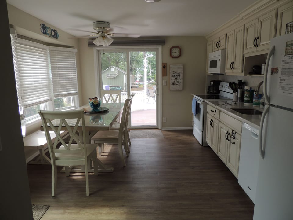 Eat-in Kitchen Looking Out To Back Deck And Yard.