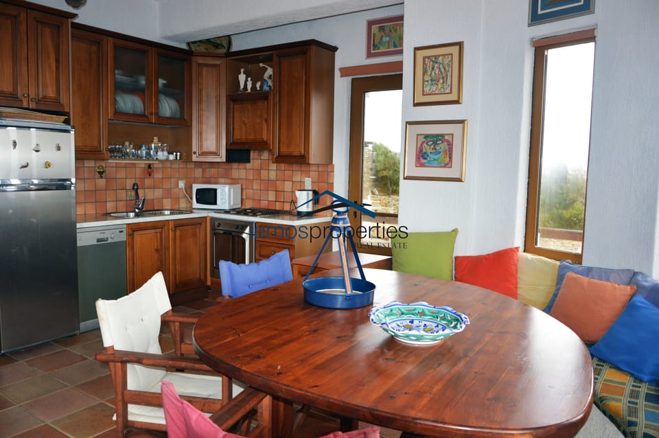 The dining area and kitchen of the top floor apartment