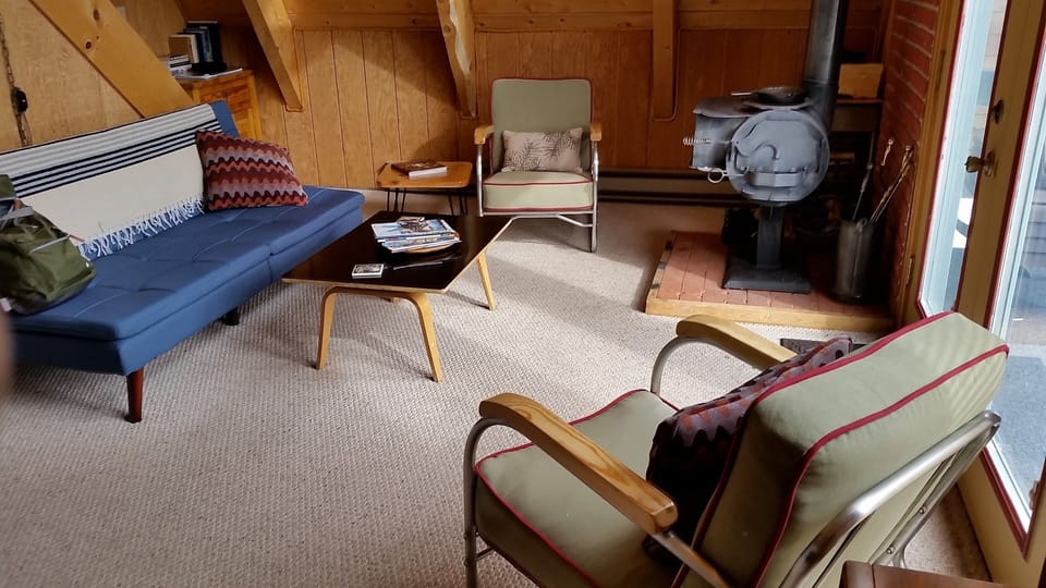 inside view of livingroom, with vintage furniture and woodstove....