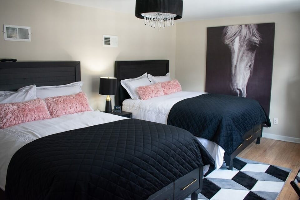 The Master bedroom has two Queen sized beds & a 50”Smart TV for Netflix/cable.