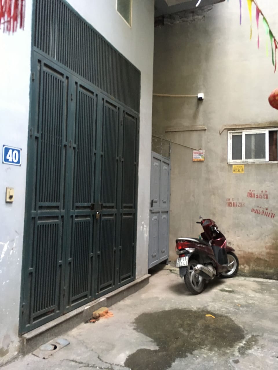 On front of my house. There is area for parking motorbike. Have a camera here