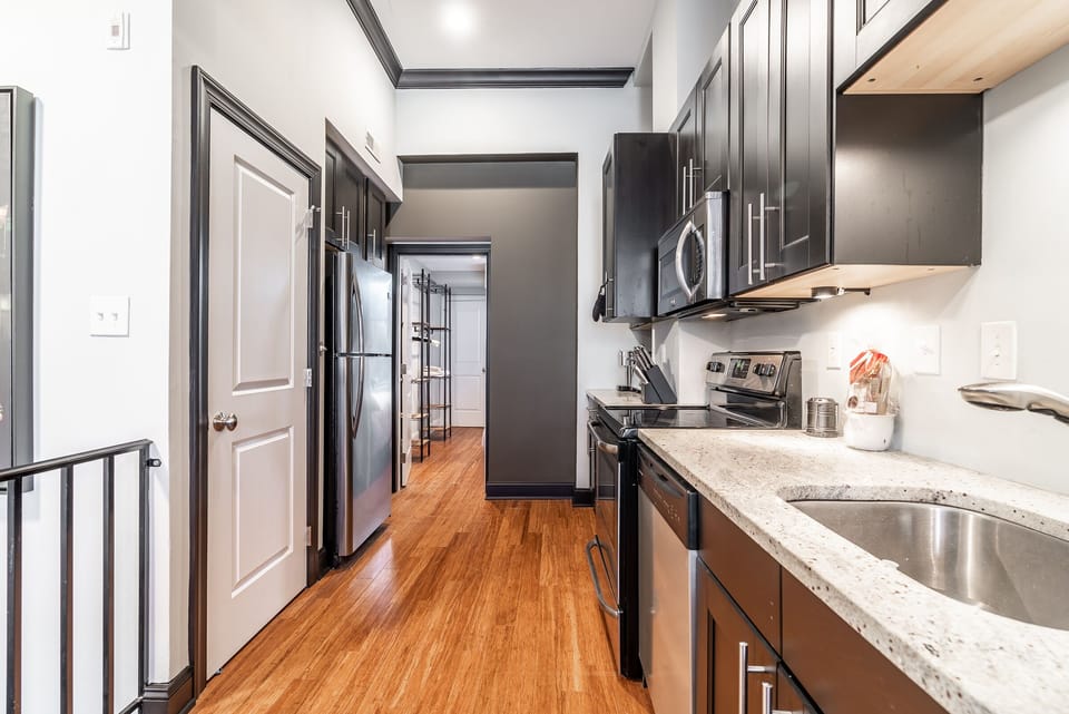 Door to the left is the laundry. Straight back is a bedroom & full bathroom