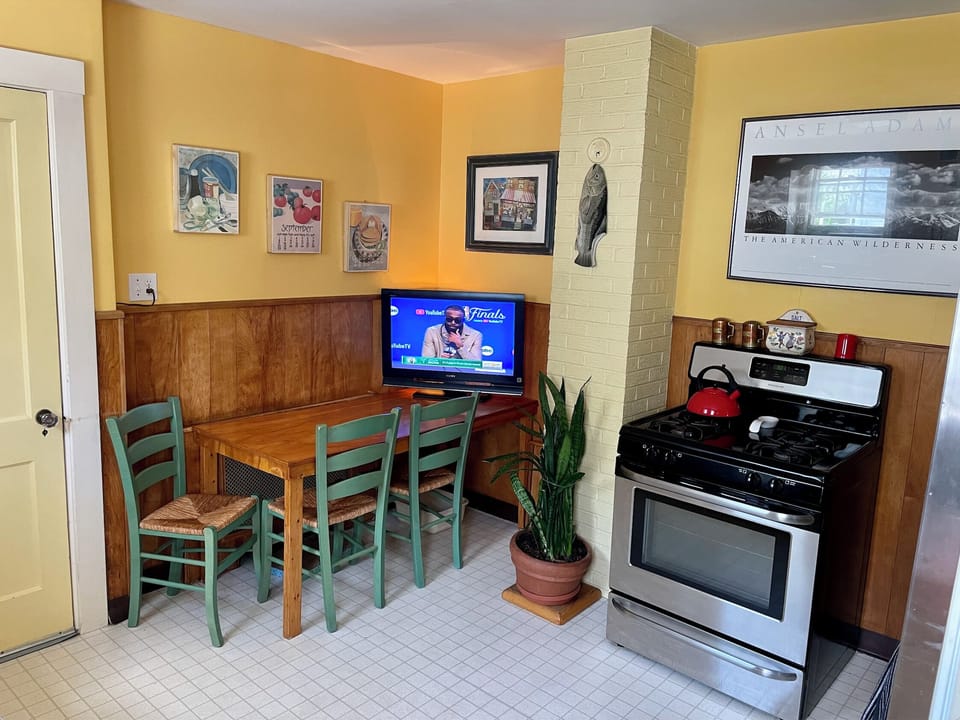 Kitchen has Table, Cable TV , Fridge, Dish Gas Stove & Washer