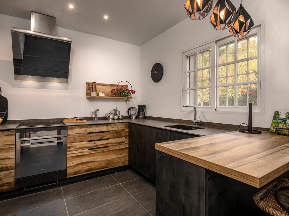 Cabinetry, Property, Countertop, Furniture, Black, Kitchen, Wood, Table, Lighting, Interior Design