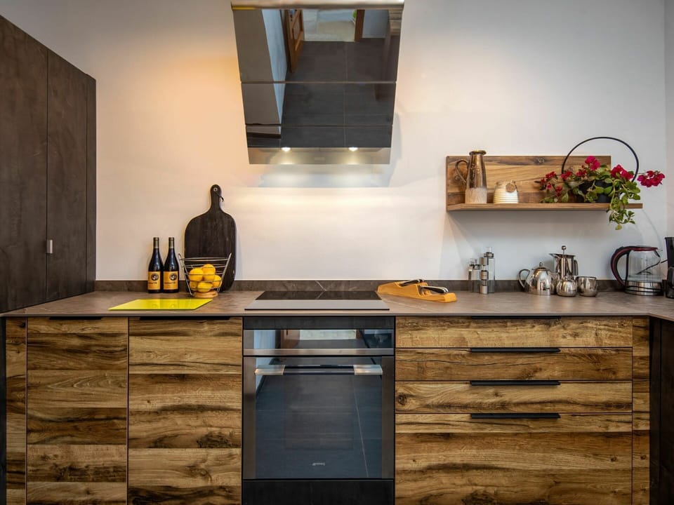 Cabinetry, Countertop, Property, Furniture, Black, Wood, Interior Design, Drawer, Kitchen Stove, Lighting