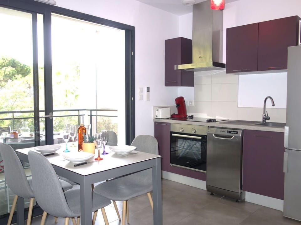 Property, Furniture, Cabinetry, Countertop, Table, Kitchen Appliance, Kitchen, Kitchen Stove, Lighting, Building