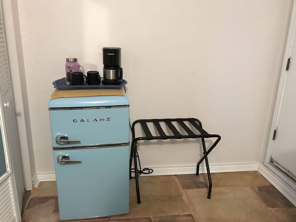 Fridge, coffee and a luggage rack for your convenience.
